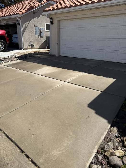 Clean driveway and walkway surface, restored and spot-free