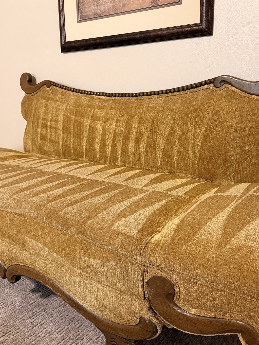 Freshly cleaned upholstered antique sofa, restored to a rich, even color